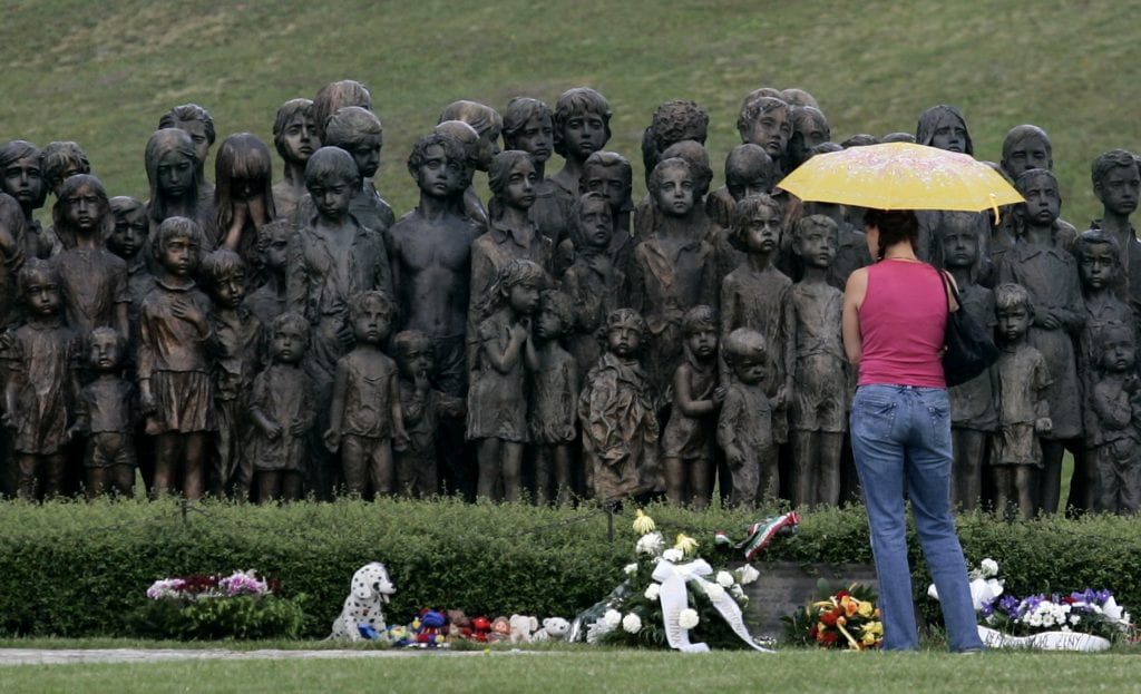 A woman stands in front of a monument to the lost children of Lidice, Czech Republic, on Sunday, June 10, 2007, during a commemoration ceremony for the victims on the 65th anniversary of the annihilation of the village in World War II. Lidice was destroyed on June 10, 1942, by Nazi troops after the assassination attempt and death of Reinhard Heydrich by Czech resistance fighters who had parachuted in from England. (AP Photo/Petr David Josek)